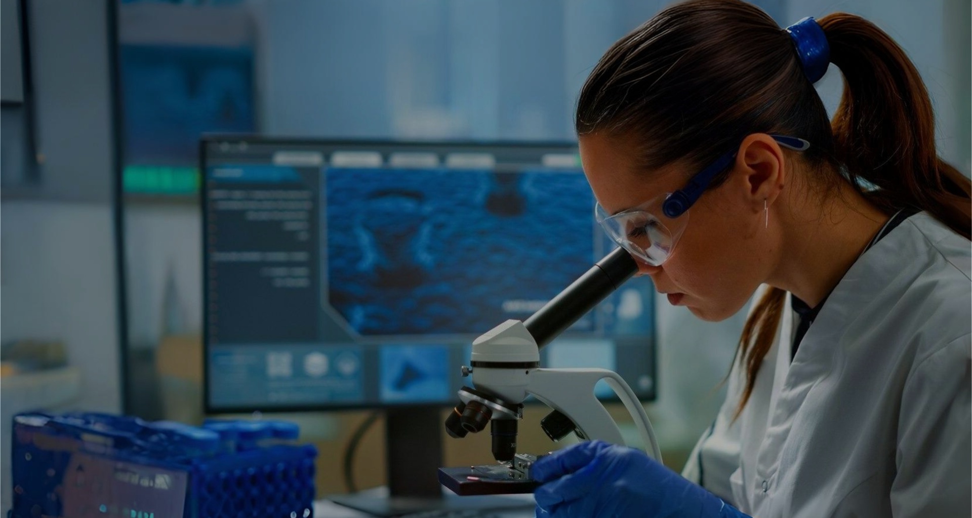 Scientist using a microscope